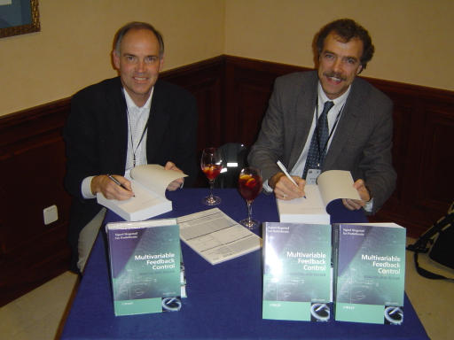 [Sigurd Skogestad and Ian Postlethwaite sihning their book in Sevilla, Spain in December 2005]
